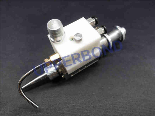 紙巻タバコ製造機械で組み立てられるペーパー付着のための信頼できるつくノズル